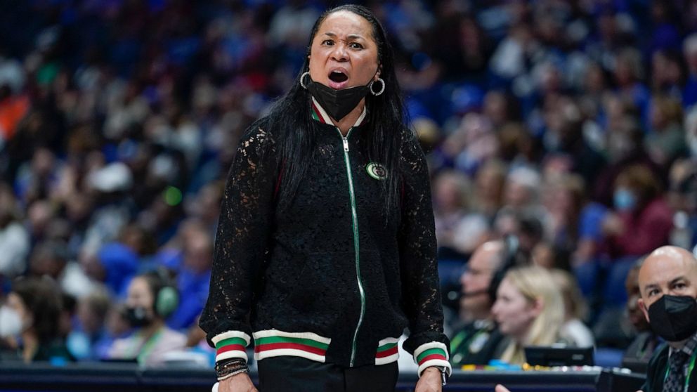 South Carolina head coach Dawn Staley watches the action during her team's loss to Kentucky in the NCAA women's college basketball Southeastern Conference tournament championship game Sunday, March 6, 2022, in Nashville, Tenn. (AP Photo/Mark Humphrey)