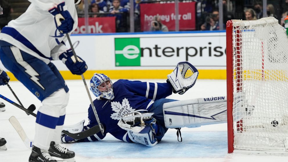 Tampa Bay Lightning defenseman Victor Hedman, left, scores on Toronto Maple Leafs goaltender Jack Campbell (36) during the first period of Game 2 of an NHL hockey Stanley Cup playoffs first-round series Wednesday, May 4, 2022, in Toronto. (Frank Gunn