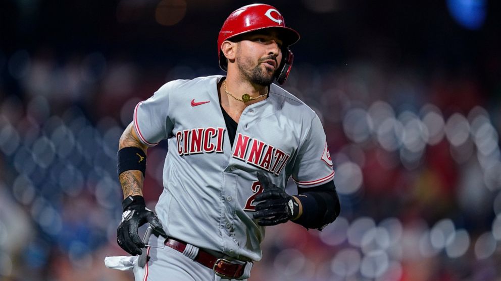 FILE - Cincinnati Reds' Nick Castellanos heads to first during the team's baseball game against the Philadelphia Phillies on Aug. 13, 2021, in Philadelphia. Castellanos and the Phillies have agreed to a $100 million, five-year contract, according to 