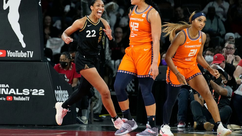 Las Vegas Aces forward A'ja Wilson (22) celebrates after a play against the Connecticut Sun during the second half in Game 2 of a WNBA basketball final playoff series Tuesday, Sept. 13, 2022, in Las Vegas. (AP Photo/John Locher)