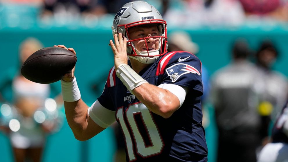 New England Patriots quarterback Mac Jones (10) aims a pass during the first half of an NFL football game against the Miami Dolphins, Sunday, Sept. 11, 2022, in Miami Gardens, Fla. (AP Photo/Rebecca Blackwell)