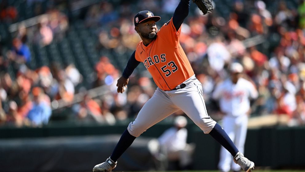Houston Astros pitcher Christian Javier delivers against the Baltimore Orioles in the first inning of a baseball game, Sunday, Sept. 25, 2022, in Baltimore. (AP Photo/Gail Burton)