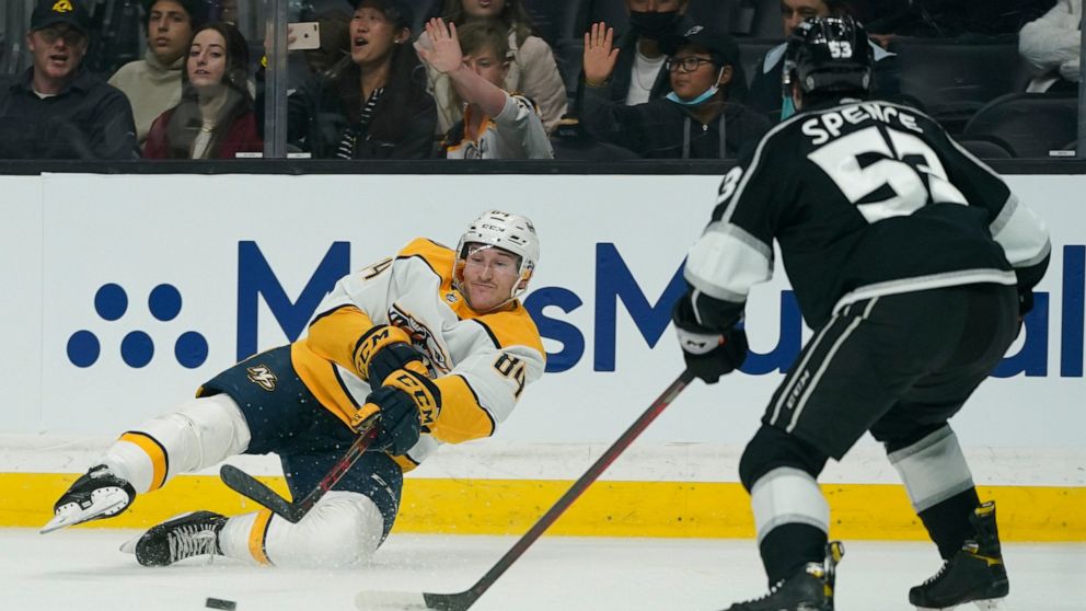 Nashville Predators left wing Tanner Jeannot (84) passes against Los Angeles Kings defenseman Jordan Spence (53) during the first period of an NHL hockey game Tuesday, March 22, 2022, in Los Angeles. (AP Photo/Ashley Landis)