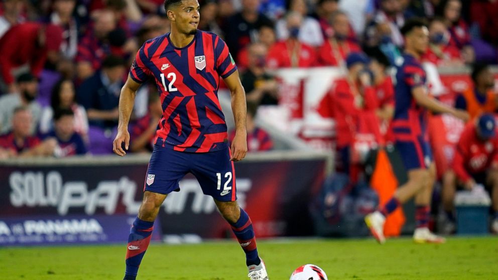 FILE - United States' Miles Robinson looks to pass the ball against Panama during the first half of a FIFA World Cup qualifying soccer match on March 27, 2022, in Orlando, Fla. Robinson was arrested Saturday, Sept. 3, 2022, at an Atlanta bar on a mis
