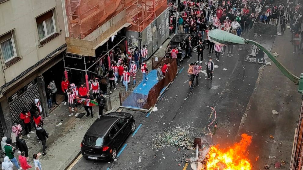 Athletic Bilbao soccer supporters gather in the street in Bilbao, northern Spain, Saturday, April 3, 2021. A few thousand Bilbao fans violated public health restrictions in place for the coronavirus pandemic on Saturday when they rallied in rowdy gro