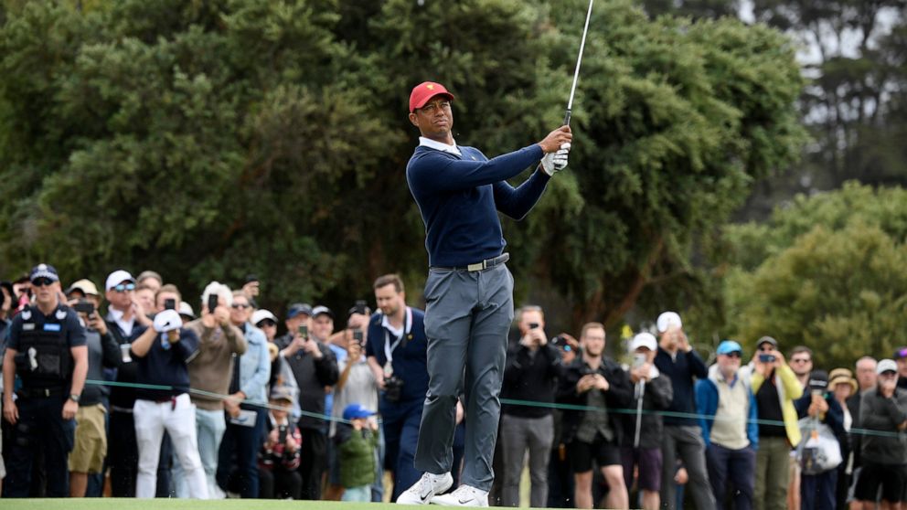 USA captain Tiger Woods hits an approach shot during a practice session ahead of the President's Cup Golf tournament in Melbourne, Tuesday, Dec. 10, 2019. (AP Photo/Andy Brownbill)