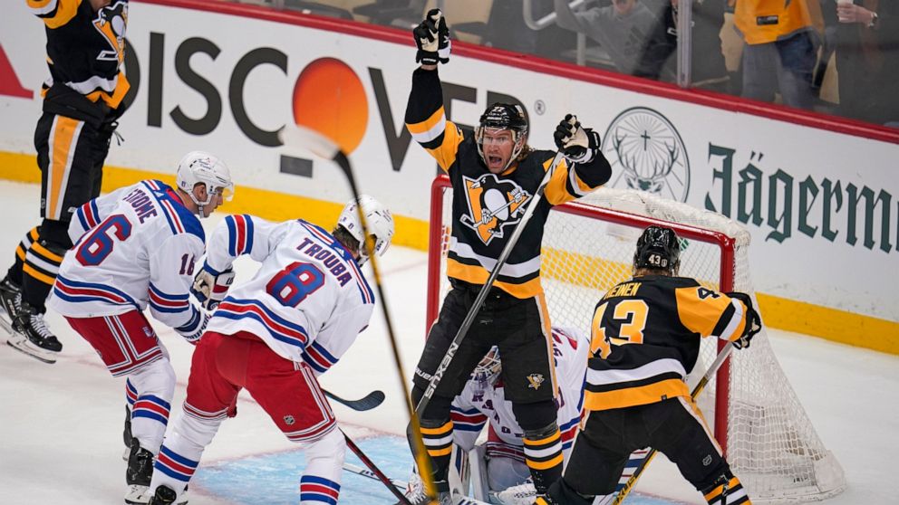 Pittsburgh Penguins' Jeff Carter (77) celebrates his goal in the first period in Game 3 of an NHL hockey Stanley Cup first-round playoff series against the New York Rangers in Pittsburgh, Saturday, May 7, 2022. (AP Photo/Gene J. Puskar)