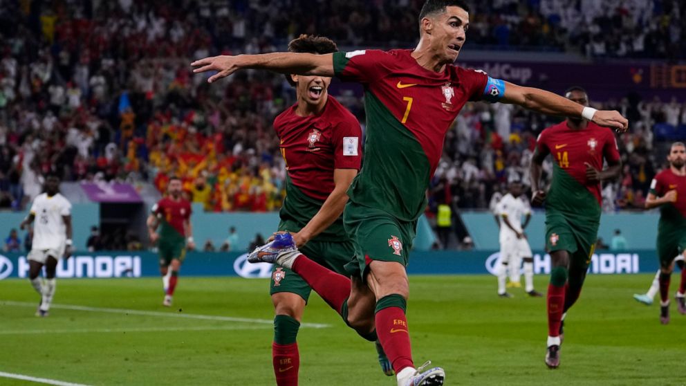 Portugal's Cristiano Ronaldo celebrates after scoring from the penalty spot his side's opening goal against Ghana during a World Cup group H soccer match at the Stadium 974 in Doha, Qatar, Thursday, Nov. 24, 2022. (AP Photo/Manu Fernandez)