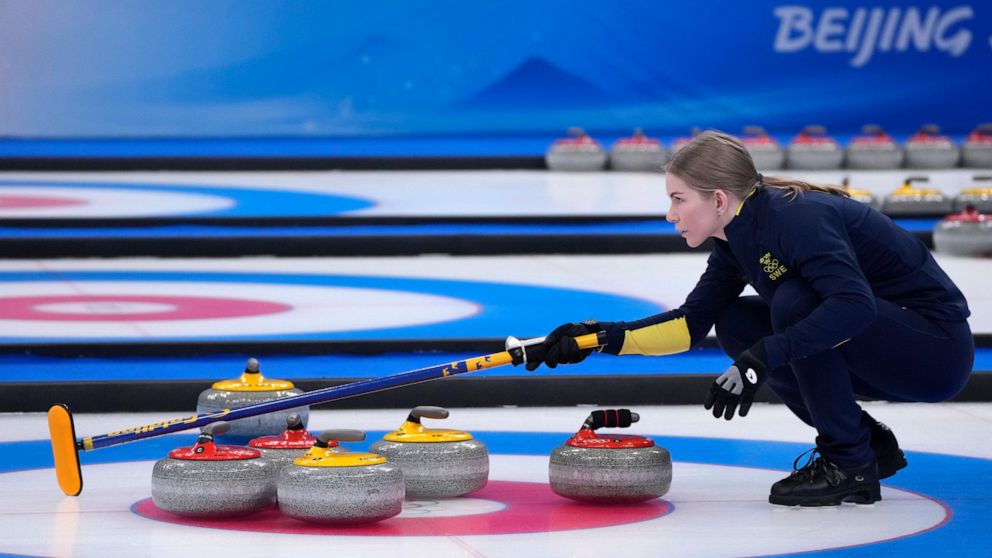 Sweden's Almida De Val, directs her teammate, during mixed doubles bronze medal final against Britain, at the 2022 Winter Olympics, Tuesday, Feb. 8, 2022, in Beijing. (AP Photo/Nariman El-Mofty)