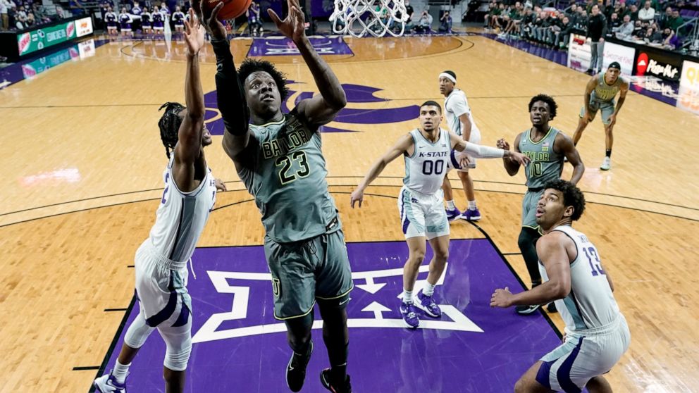 Baylor forward Jonathan Tchamwa Tchatchoua (23) puts up a shot during the first half of an NCAA college basketball game against Kansas State Wednesday, Feb. 9, 2022, in Manhattan, Kan. (AP Photo/Charlie Riedel)