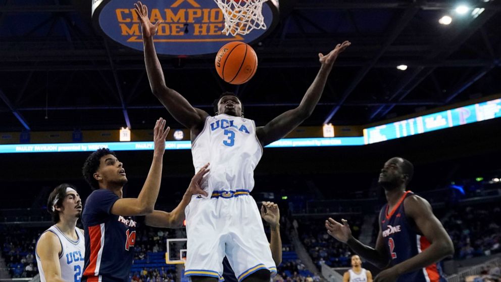 UCLA forward Adem Bona (3) grabs a rebound against Pepperdine during the first half of an NCAA college basketball game Wednesday, Nov. 23, 2022, in Los Angeles. (AP Photo/Marcio Jose Sanchez)