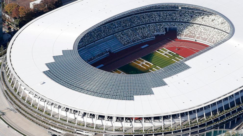 The new National Stadium, main stadium for the 2020 Tokyo Olympics and Paralympics, is seen after its completion in Tokyo Saturday, Nov. 30, 2019. (Kyodo News via AP)