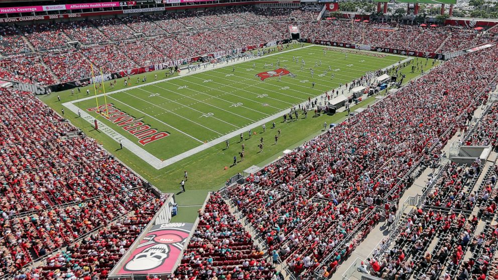 FILE - The Miami Dolphins and Tampa Bay Buccaneers play an NFL football game at Raymond James Stadium in Tampa, Fla., Oct. 10, 2021. A boy ran onto the field and was tackled hard by a security guard in the second quarter of Tampa Bay’s game against A
