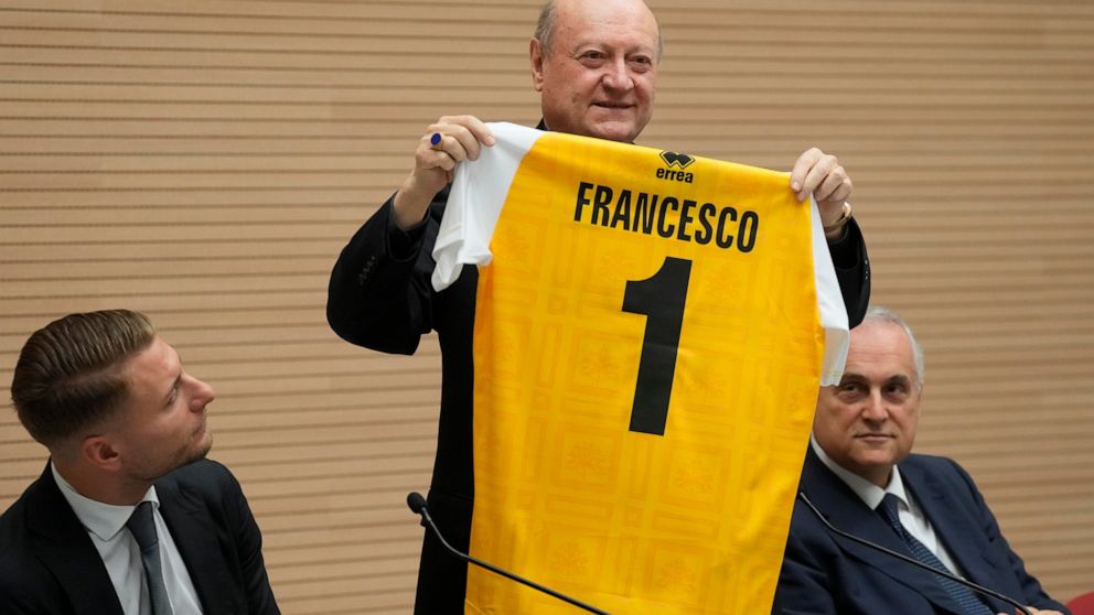 Cardinal Gianfranco Ravasi shows to journalists the jersey of the Vatican soccer team which will be donated to Pope Francis as he presents the soccer match between the Vatican soccer team "Fratelli Tutti" (All Brothers) and the World Rom Organization