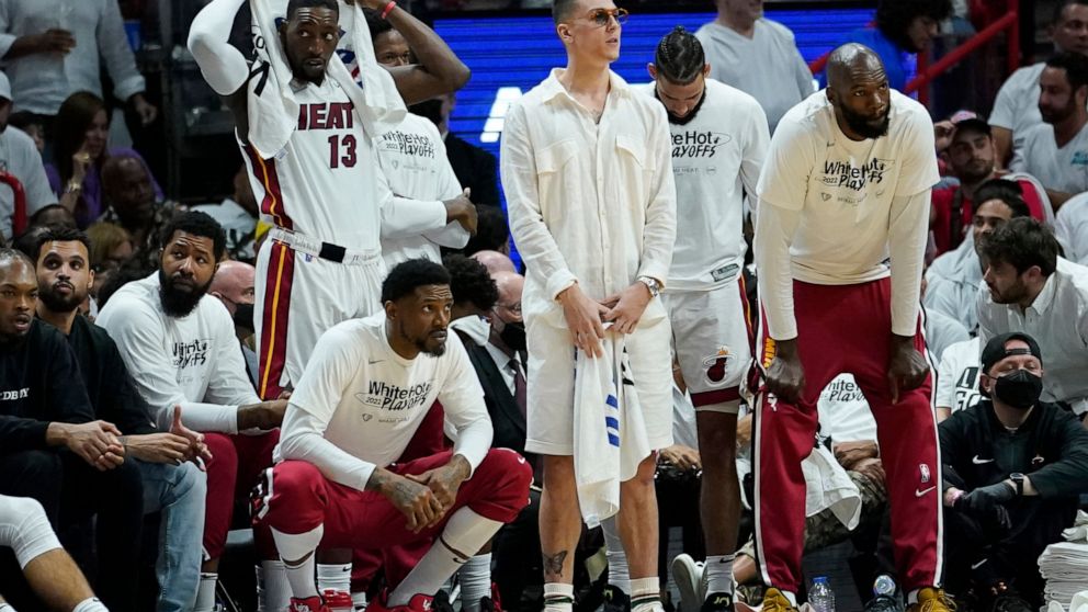 The Miami Heat bench follows the game as they fall behind the Boston Celtics during the second half of Game 5 of the NBA basketball Eastern Conference finals playoff series, Wednesday, May 25, 2022, in Miami. (AP Photo/Lynne Sladky)