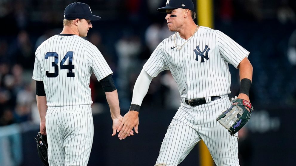 New York Yankees' Michael King, left, and Aaron Judge celebrate after a baseball game against the Toronto Blue Jays, Thursday, April 14, 2022, in New York. (AP Photo/Frank Franklin II)