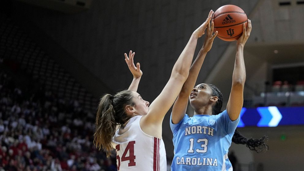 North Carolina's Teonni Key (13) shoots over Indiana's Mackenzie Holmes (54) during the first half of an NCAA college basketball game, Thursday, Dec. 1, 2022, in Bloomington, Ind. (AP Photo/Darron Cummings)