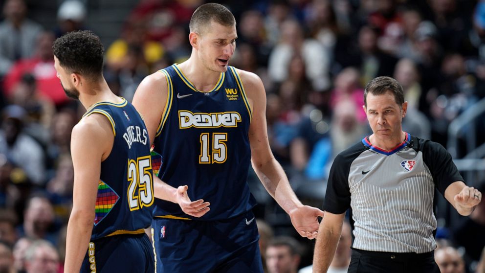 Denver Nuggets center Nikola Jokic argues for a call with referee Brian Forte during the first half of the team's NBA basketball game against the Los Angeles Clippers on Tuesday, March 22, 2022, in Denver. (AP Photo/David Zalubowski)
