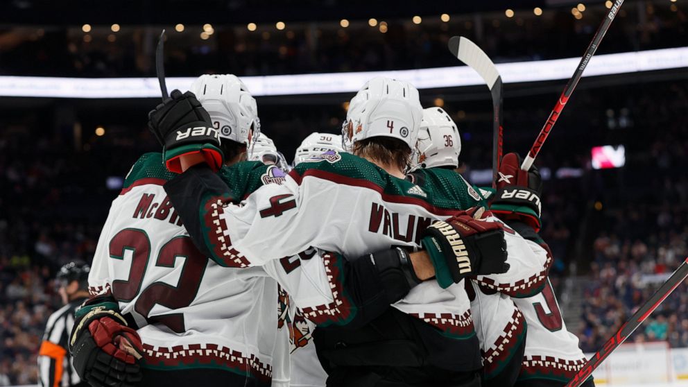 Arizona Coyotes players celebrate their goal against the Columbus Blue Jackets during the third period of an NHL hockey game Tuesday, Oct. 25, 2022, in Columbus, Ohio. (AP Photo/Jay LaPrete)