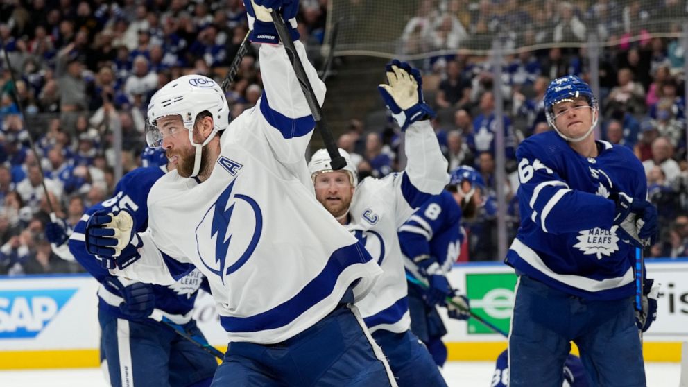 Tampa Bay Lightning defenseman Victor Hedman (77) celebrates his goal against the Toronto Maple Leafs with center Steven Stamkos (91) during the first period of Game 2 of an NHL hockey Stanley Cup playoffs first-round series Wednesday, May 4, 2022, i