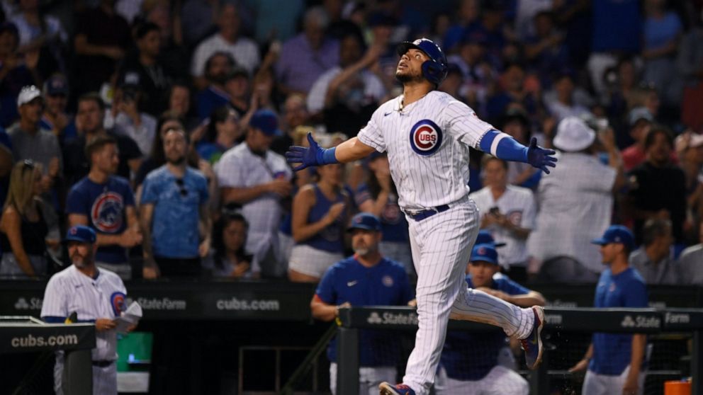 Chicago Cubs' Willson Contreras celebrates while running the bases after hitting a two-run home run during the fifth inning of the team's baseball game against the Cincinnati Reds on Wednesday, June 29, 2022, in Chicago. (AP Photo/Paul Beaty)