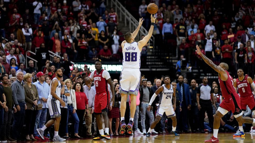 Sacramento Kings' Nemanja Bjelica (88) hits the game-winning 3-point-basket at the buzzer in the second half of an NBA basketball game against the Houston Rockets Monday, Dec. 9, 2019, in Houston. The Kings won 119-118. (AP Photo/David J. Phillip)