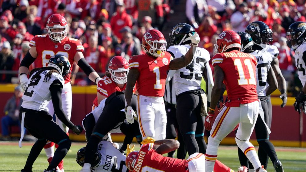 Kansas City Chiefs wide receiver JuJu Smith-Schuster (9) rolls on the field after being injured during the first half of an NFL football game against the Jacksonville Jaguars Sunday, Nov. 13, 2022, in Kansas City, Mo. (AP Photo/Ed Zurga)