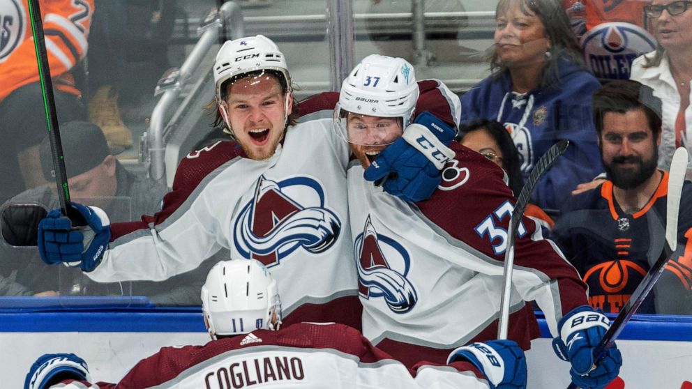 Colorado Avalanche's Bowen Byram (4), J.T. Compher (37) and Andrew Cogliano (11) celebrate a goal against the Edmonton Oilers during the third period of Game 3 of the NHL hockey Stanley Cup playoffs Western Conference finals, Saturday, June 4, 2022, 