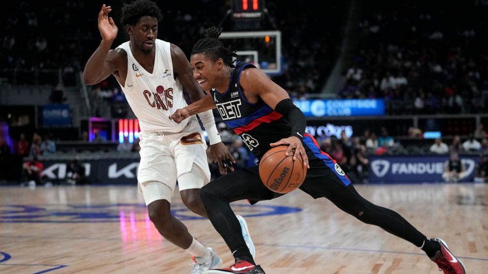 Detroit Pistons guard Jaden Ivey (23) drives on Cleveland Cavaliers guard Caris LeVert (3) in the second half of an NBA basketball game in Detroit, Friday, Nov. 4, 2022. (AP Photo/Paul Sancya)