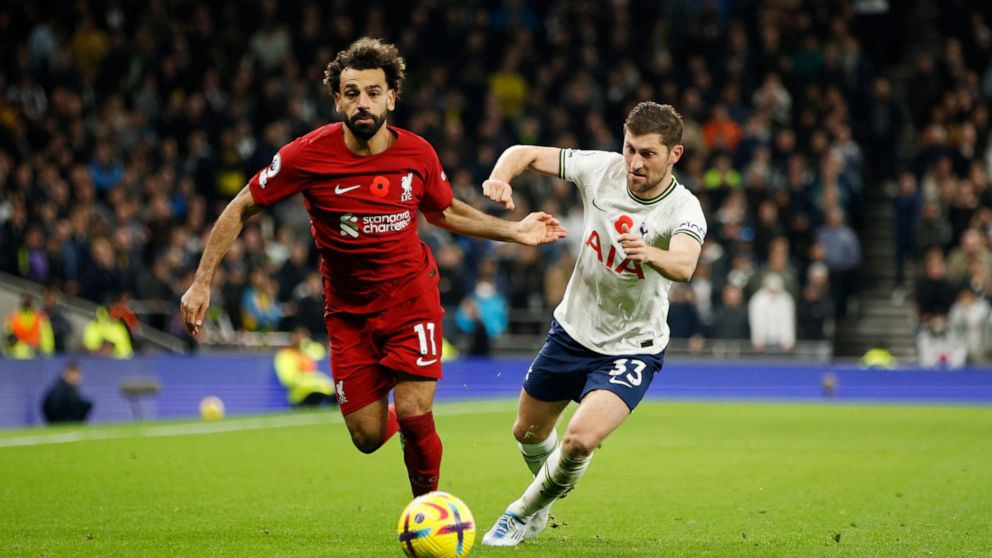 Liverpool's Mohamed Salah, left, challenges for the ball with Tottenham's Ben Davies during the English Premier League soccer match between Tottenham Hotspur and Liverpool at Tottenham Hotspur Stadium, in London, Sunday, Nov. 6, 2022. (AP Photo/David