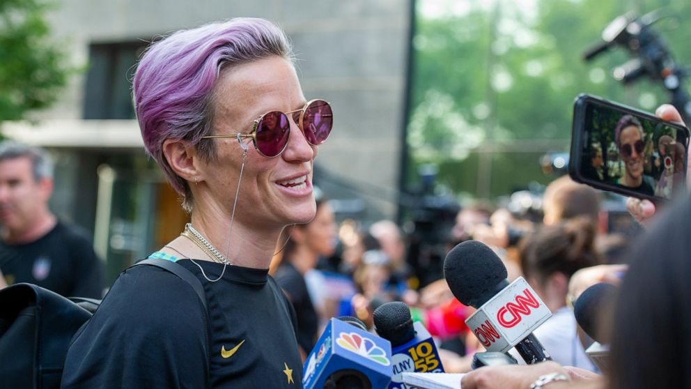 United States women's soccer team member Megan Rapinoe speaks to the media upon her arrival at a hotel Monday, July 8, 2019, in New York. The city will honor the team with a parade Wednesday for their fourth Women's World Cup victory. (AP Photo/Corey