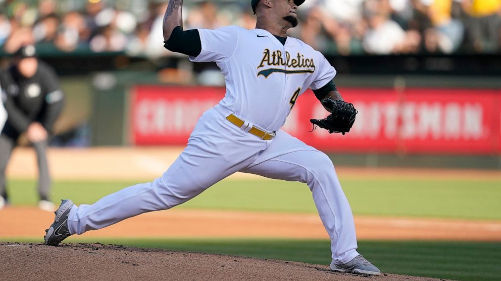 Oakland Athletics' Frankie Montas pitches against the Houston Astros during the first inning of a baseball game in Oakland, Calif., Tuesday, July 26, 2022. (AP Photo/Jeff Chiu)