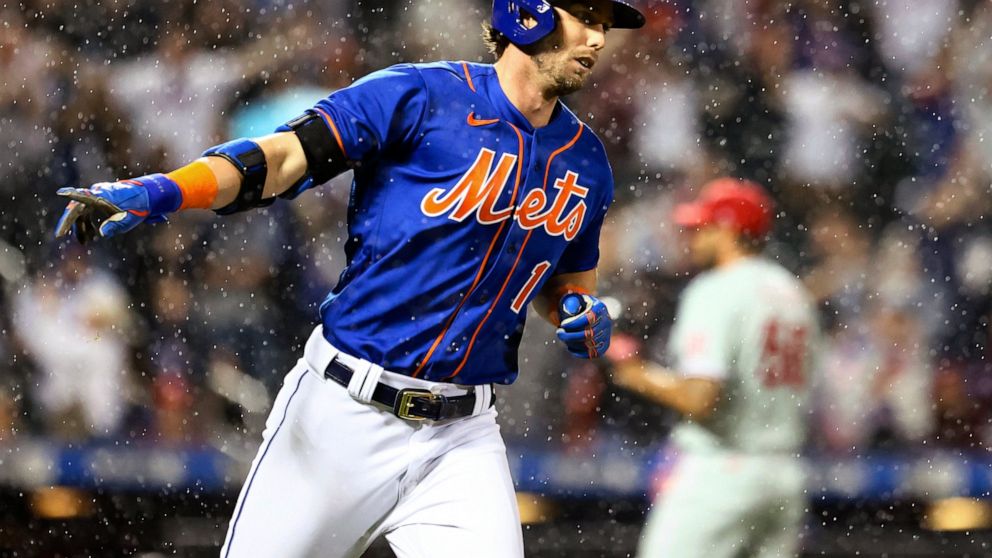 New York Mets' Jeff McNeil runs the bases after hitting a three-run home run against the Philadelphia Phillies during the fourth inning of a baseball game Saturday, May 28, 2022, in New York. (AP Photo/Jessie Alcheh)