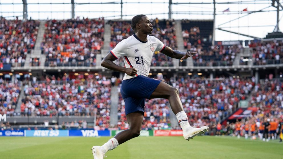 U.S. forward Tim Weah celebrates his goal during the first half of the team's international friendly soccer match against Morocco, Wednesday, June 1, 2022, in Cincinnati. (AP Photo/Jeff Dean)