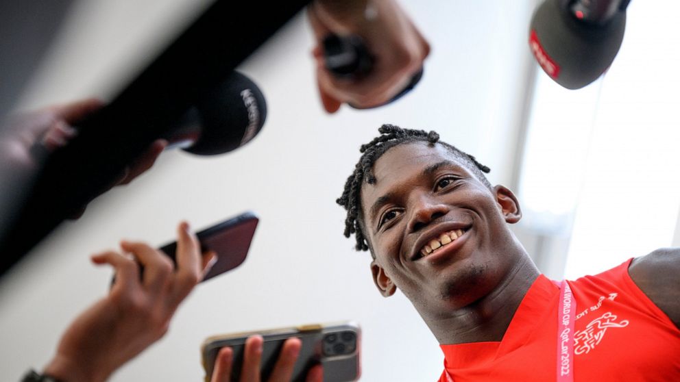 Switzerland's forward Breel Embolo speaks to journalists during after a closed training session of Swiss national soccer team in preparation for the World Cup Qatar 2022 at the University of Doha for Science and Technology training facilities, in Doh
