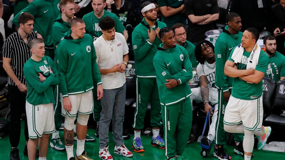 The Boston Celtics react from the sidelines during the fourth quarter of Game 4 of basketball's NBA Finals against the Golden State Warriors, Friday, June 10, 2022, in Boston. (AP Photo/Michael Dwyer)