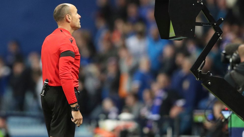 FILE - Referee Antonio Mateu Lahoz from Spain checks VAR during the Champions League group A soccer match between Rangers and Napoli at the Ibrox stadium in Glasgow, Scotland, Wednesday, Sept. 14, 2022. VAR's World Cup debut came in 2018 but referees