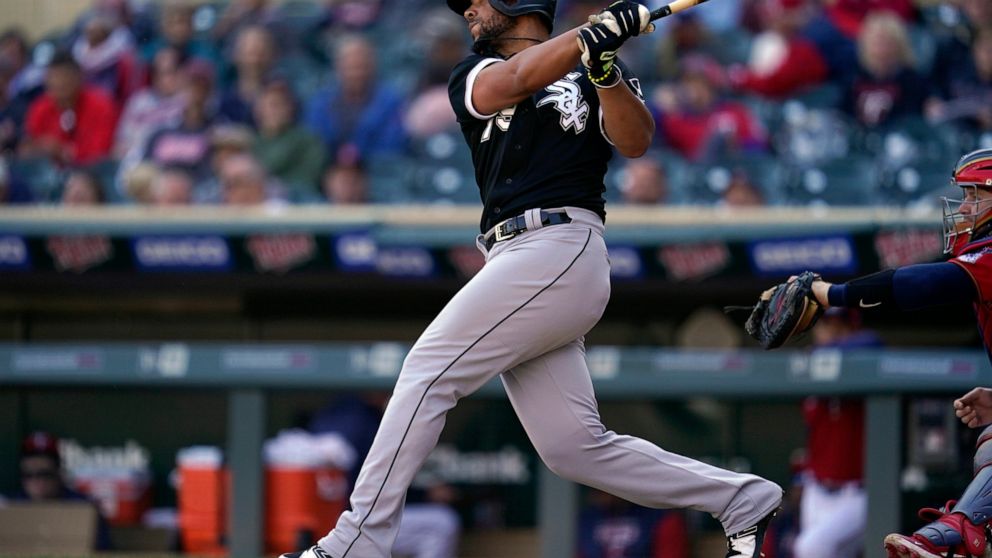 FILE - Chicago White Sox's Jose Abreu hits an RBI-double during the eighth inning of a baseball game against the Minnesota Twins, on Thursday, Sept. 29, 2022, in Minneapolis. Abreu and the World Series champion Astros agreed to a three-year contract 