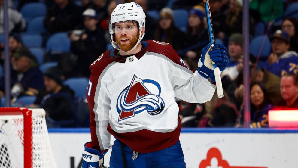 Colorado Avalanche left wing J.T. Compher (37) celebrates his second goal against the Buffalo Sabres, during the second period of an NHL hockey game Thursday, Dec. 1, 2022, in Buffalo, N.Y. (AP Photo/Jeffrey T. Barnes)