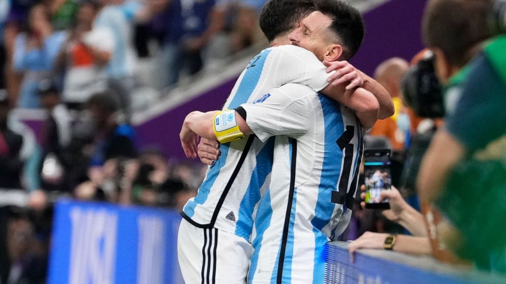 Argentina's Julian Alvarez, left, and Lionel Messi celebrate third goal during the World Cup semifinal soccer match between Argentina and Croatia at the Lusail Stadium in Lusail, Qatar, Tuesday, Dec. 13, 2022. (AP Photo/Manu Fernandez)