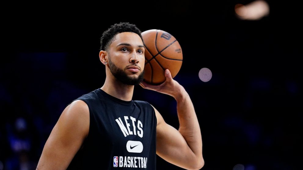 FILE - Brooklyn Nets' Ben Simmons watches practice before an NBA basketball game, Thursday, March 10, 2022, in Philadelphia. Simmons hopes to play for the Brooklyn Nets during their first-round series against Boston, though he said he probably won’t 