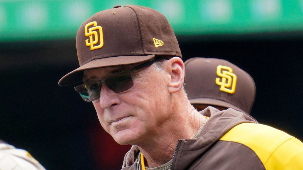 FILE - San Diego Padres manager Bob Melvin stands in the dugout during the first inning of a baseball game against the Pittsburgh Pirates in Pittsburgh, May 1, 2022. Melvin says he'll have prostate surgery on Wednesday, May 11, 2022, and hopes he mis