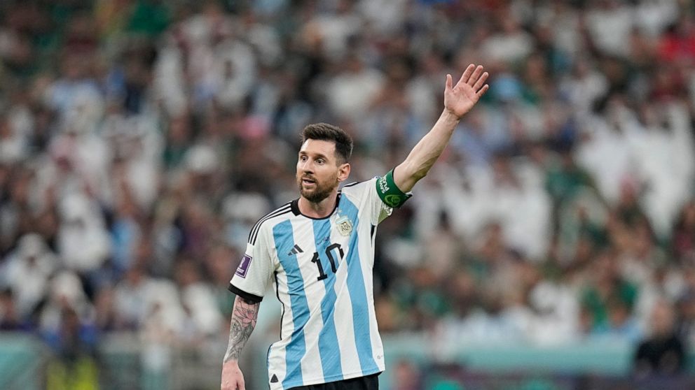Argentina's Lionel Messi gestures during the World Cup group C soccer match between Argentina and Mexico, at the Lusail Stadium in Lusail, Qatar, Saturday, Nov. 26, 2022. (AP Photo/Ariel Schalit)