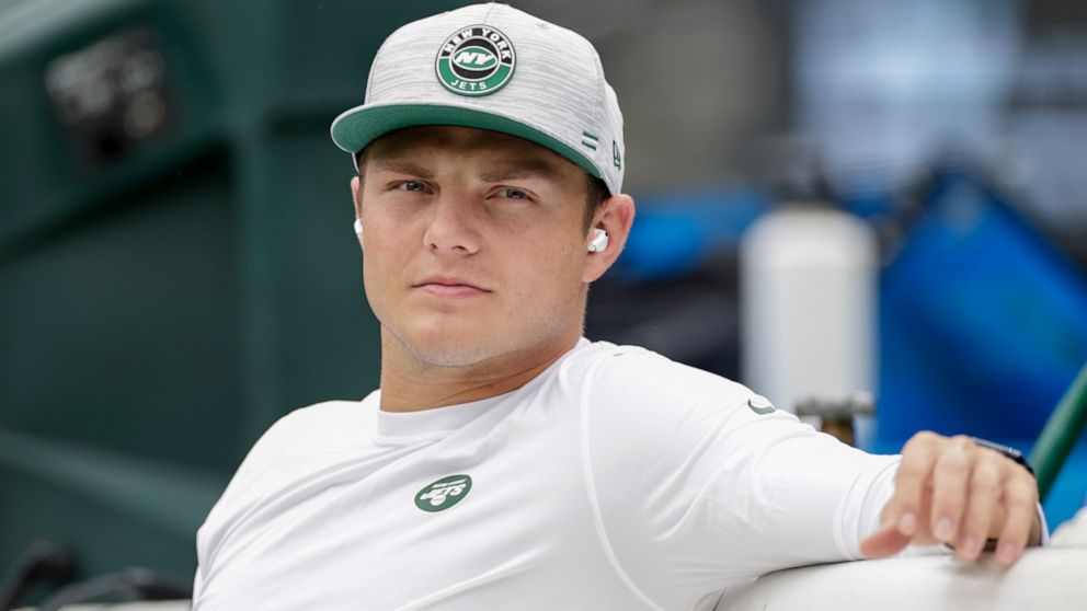 New York Jets quarterback Zach Wilson sits on the bench during practice before a preseason NFL football game against the New York Giants, Sunday, Aug. 28, 2022, in East Rutherford, N.J. (AP Photo/Adam Hunger)
