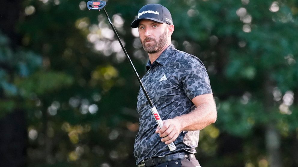 Dustin Johnson looks at his putter after missing a putt on the 16th green during the second round of the LIV Golf Invitational-Boston tournament, Saturday, Sept. 3, 2022, in Bolton, Mass. (AP Photo/Mary Schwalm)