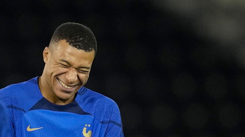 France's Kylian Mbappe jokes during a training session at the Jassim Bin Hamad stadium in Doha, Qatar, Thursday, Dec. 8, 2022. France will play against England during their World Cup quarter-final soccer match on Dec. 10. (AP Photo/Christophe Ena)