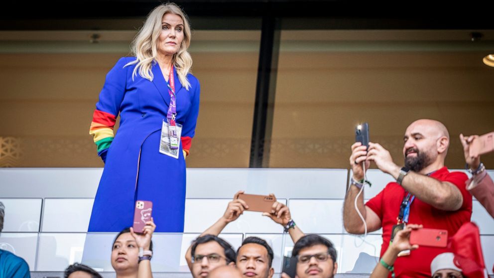 Former Danish Prime Minister Helle Thorning-Schmidt, left, wears a rainbow-colored armband before a World Cup group D soccer match between Denmark and Tunisia, at the Education City Stadium, in Doha, Qatar, Tuesday, Nov, 22, 2022. (Mads Claus Rasmuss