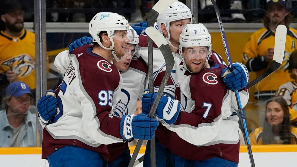 Colorado Avalanche players celebrate after a goal by Valeri Nichushkin (13) during the third period in Game 4 of an NHL hockey first-round playoff series against the Nashville Predators Monday, May 9, 2022, in Nashville, Tenn. The Avalanche won 5-3 t