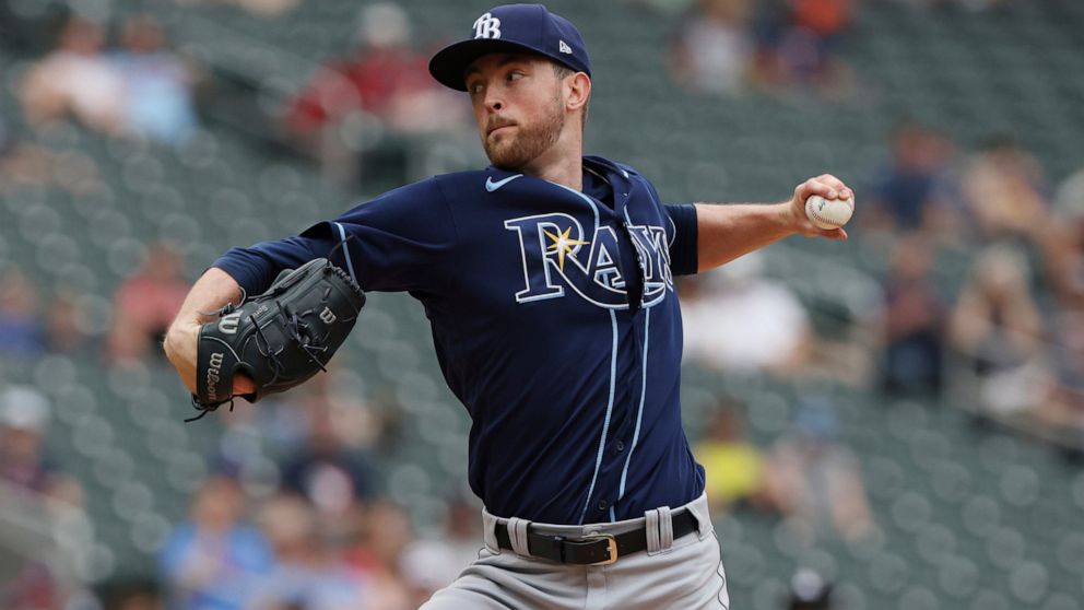Tampa Bay Rays starting pitcher Jeffrey Springs (59) throws during the first inning of a baseball game against the Minnesota Twins, Sunday, June 12, 2022, in Minneapolis. (AP Photo/Stacy Bengs)