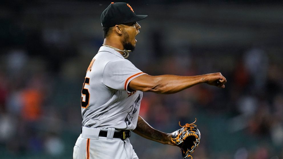 San Francisco Giants relief pitcher Camilo Doval reacts to the final out against the Detroit Tigers in the ninth inning of a baseball game in Detroit, Tuesday, Aug. 23, 2022. The Giants won 3-1. (AP Photo/Paul Sancya)